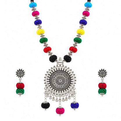 JFL - Jewellery for Less Oxidized German Silver Sun Pendant Multicolor Thread Beads Necklace and Earrings with Bracelet Set for Women | Handmade Cotton Thread Jewellery with Adjustable Black Dori | Navratri Special Tribal Jewellery