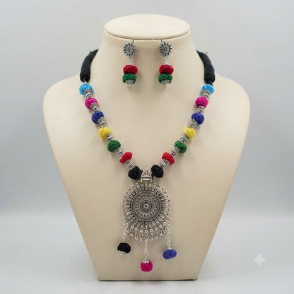 JFL - Jewellery for Less Oxidized German Silver Sun Pendant Multicolor Thread Beads Necklace with Earrings Set for Women | Handmade Cotton Thread Jewellery with Adjustable Black Dori | Navratri Special Tribal Jewellery