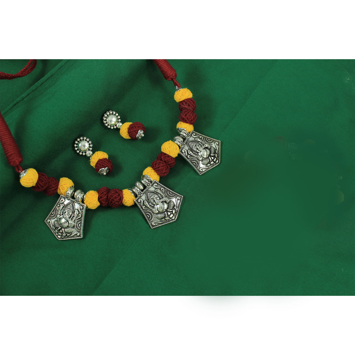 JFL‑Jewellery for Less Maroon & Yellow Cotton Thread Jewellery Set – Necklace, Earrings with Oxidised Silver Lord Ganesha Pendant– Jewellery for Women & Girls – Navratri,Garba