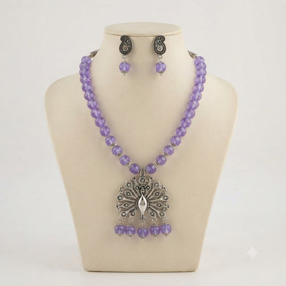 JFL - Jewellery for Less Oxidized German Silver Peacock Pendant Purple Crystal Beads Necklace with Earrings Set for Women | Antique Silver Design Jewellery Set | Navratri Special Traditional Jewellery