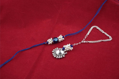 Forless Handmade Rakhi Combo Couple Pair Blue Evil Eye Rakhi And Silver Plated Jhumki Pearl Bracelet For Bhaiya Bhabhi With Roli Chawal And Written Greeting Note