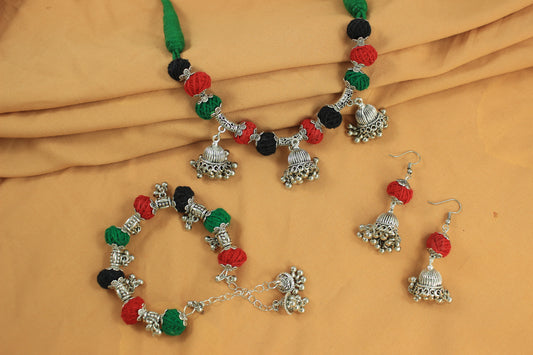 JFL-Jewellery for Less Red, Green & Black Cotton Thread Jewellery Set – Necklace, Earrings & Bracelet with Oxidised Silver Dome‑Shaped Jhumka Pendants & Bead Drops – Women & Girls – Navratri, Garba