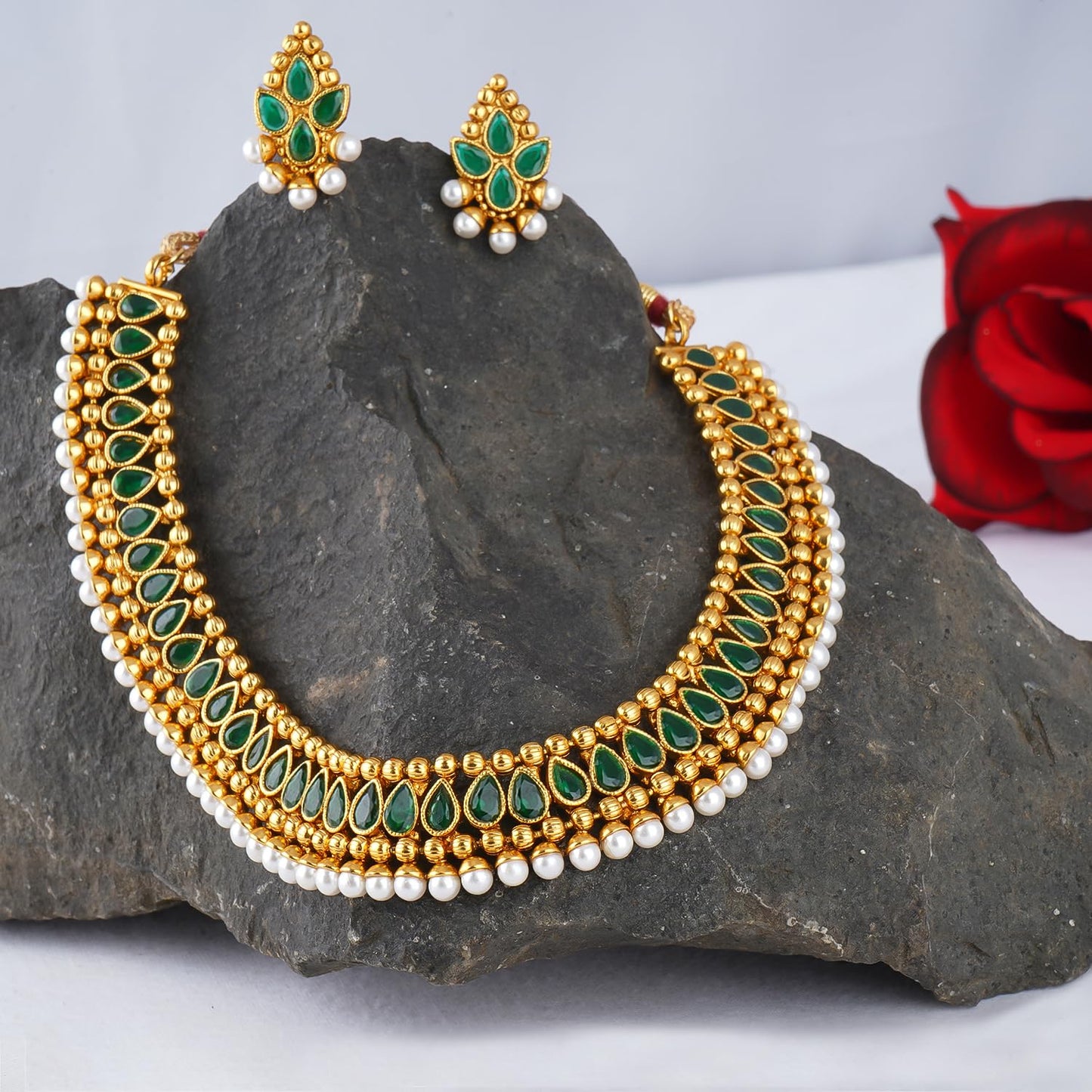 Gold Plated Necklace Set Studded With Green Stones And Embelished With Pearls
