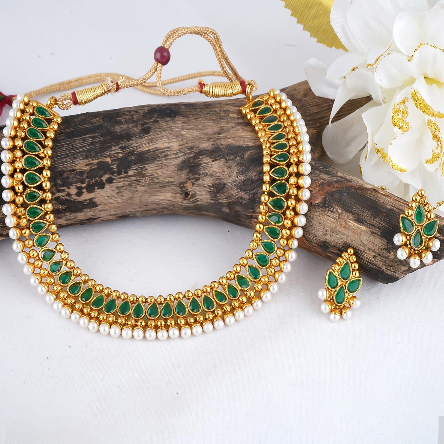 Gold Plated Necklace Set Studded With Green Stones And Embelished With Pearls