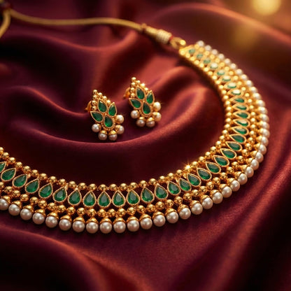 Gold Plated Necklace Set Studded With Green Stones And Embelished With Pearls