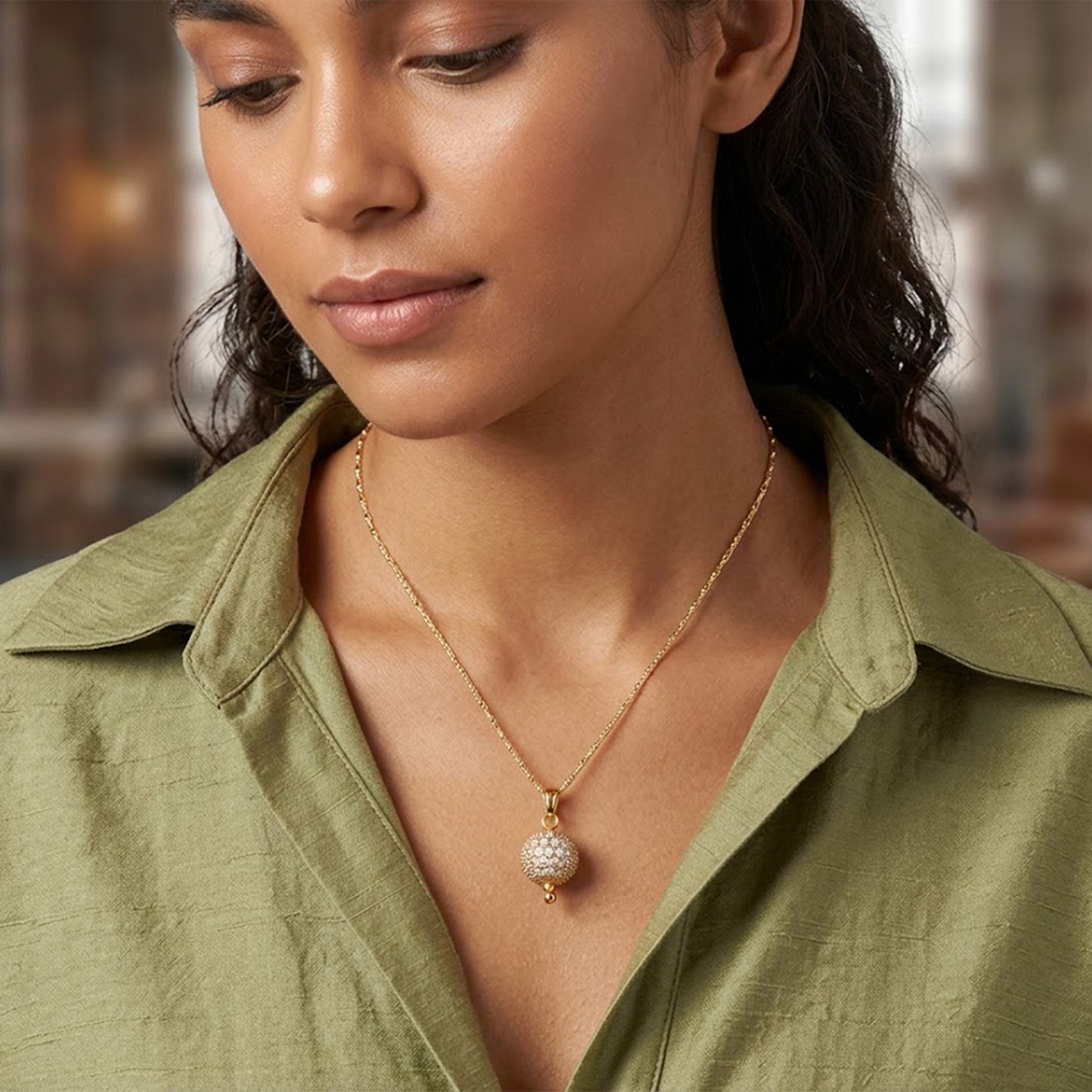 Gold Plated American Diamond Studded Single Ball Pendant With Chain .