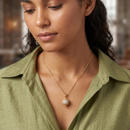 Gold Plated American Diamond Studded Single Ball Pendant With Chain .