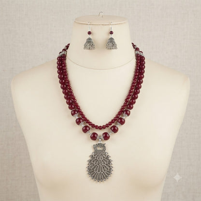 JFL - Jewellery for Less Maroon Beaded Double Layer Necklace Set with Oxidized Peacock Pendant & Matching Jhumkas – Ethnic Jewellery Set for Women