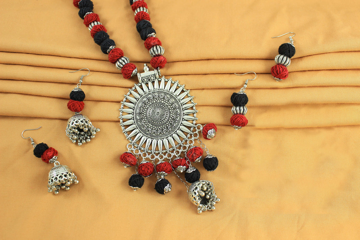 JFL‑Jewellery for Less Red & Black Cotton Thread Jewellery Set – Necklace,2 Pairs of Earrings with Oxidised Silver Circular Floral Pendant, Jhumka Danglers & Bead Drops –Navratri,Garba